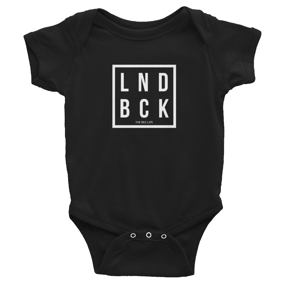 Just Out Here Tryna Get Our LND BCK Infant Bodysuit
