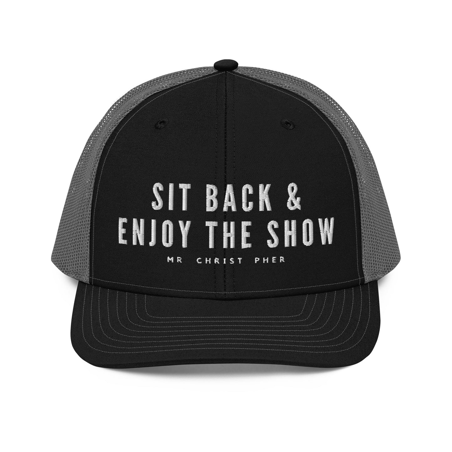 Sit Back & Enjoy The Show by @Mr.Christ0pher Trucker Hat