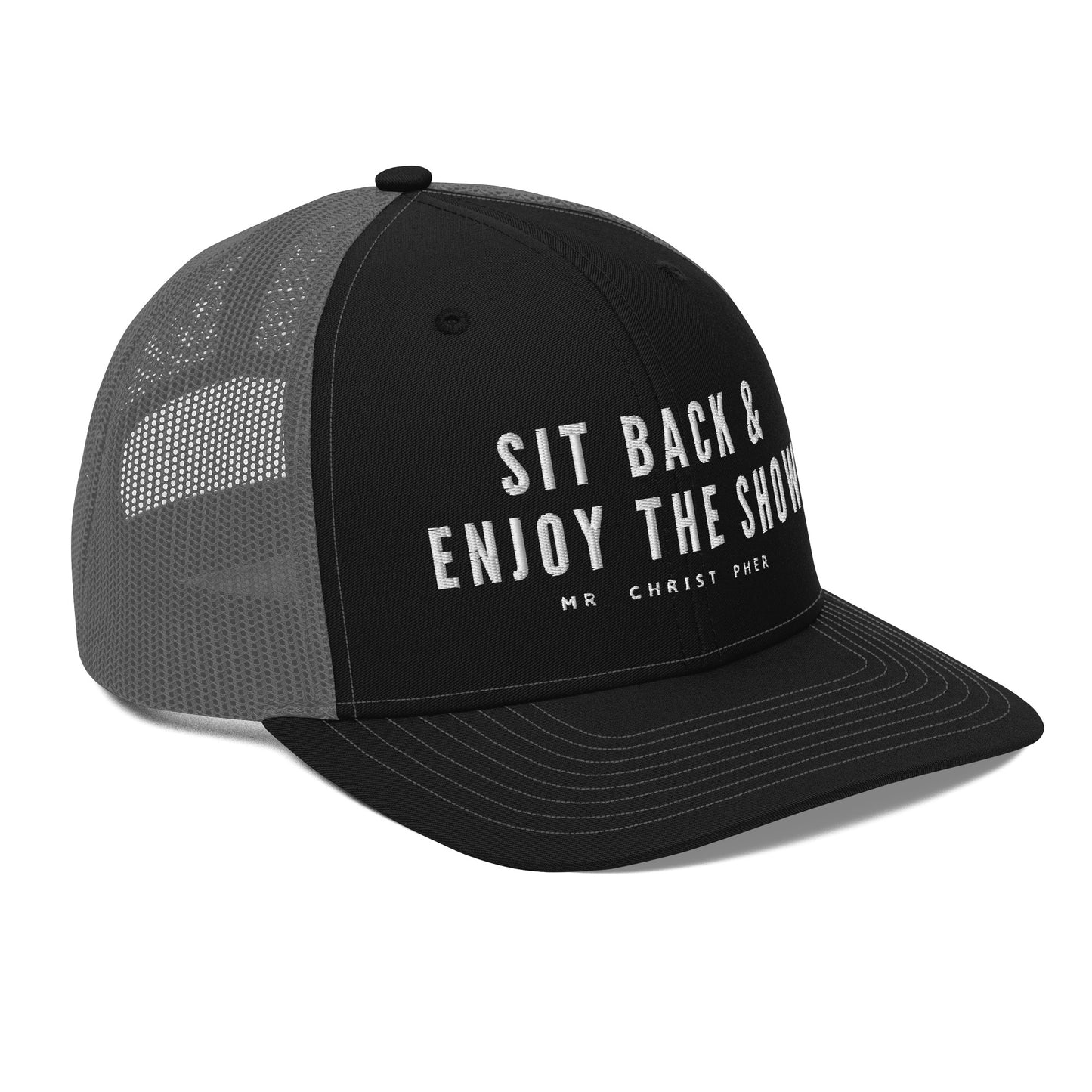 Sit Back & Enjoy The Show by @Mr.Christ0pher Trucker Hat