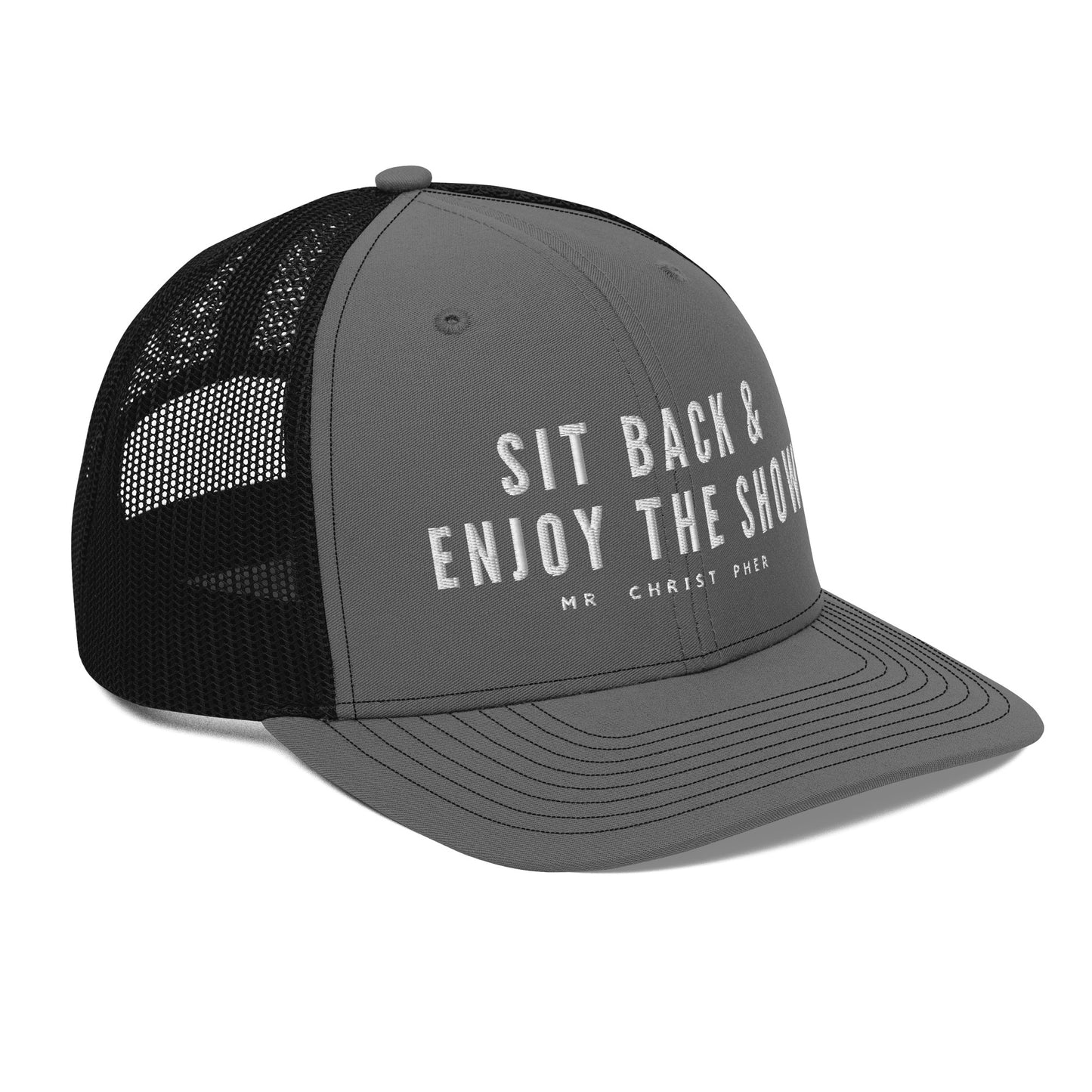 Sit Back & Enjoy The Show by @Mr.Christ0pher Trucker Hat